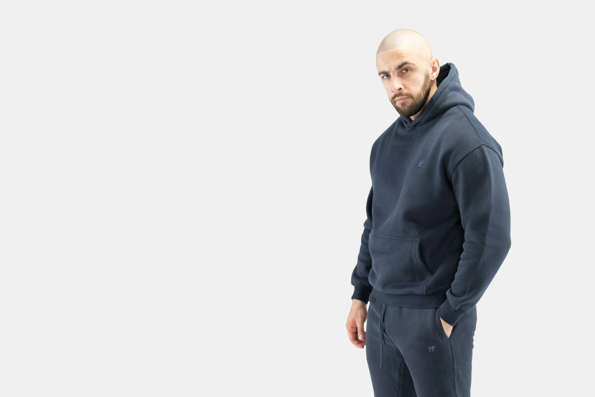 Body Builder wearing Interpro Fitness Mens Gym Hoodie in Studio Setting