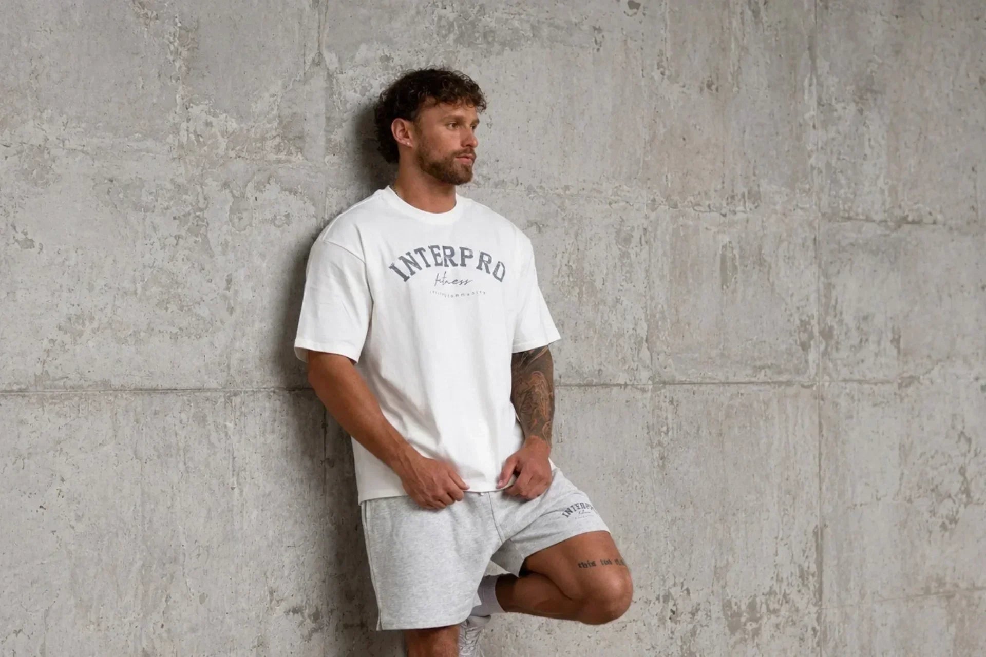 Man wearing white oversized gym t shirt 