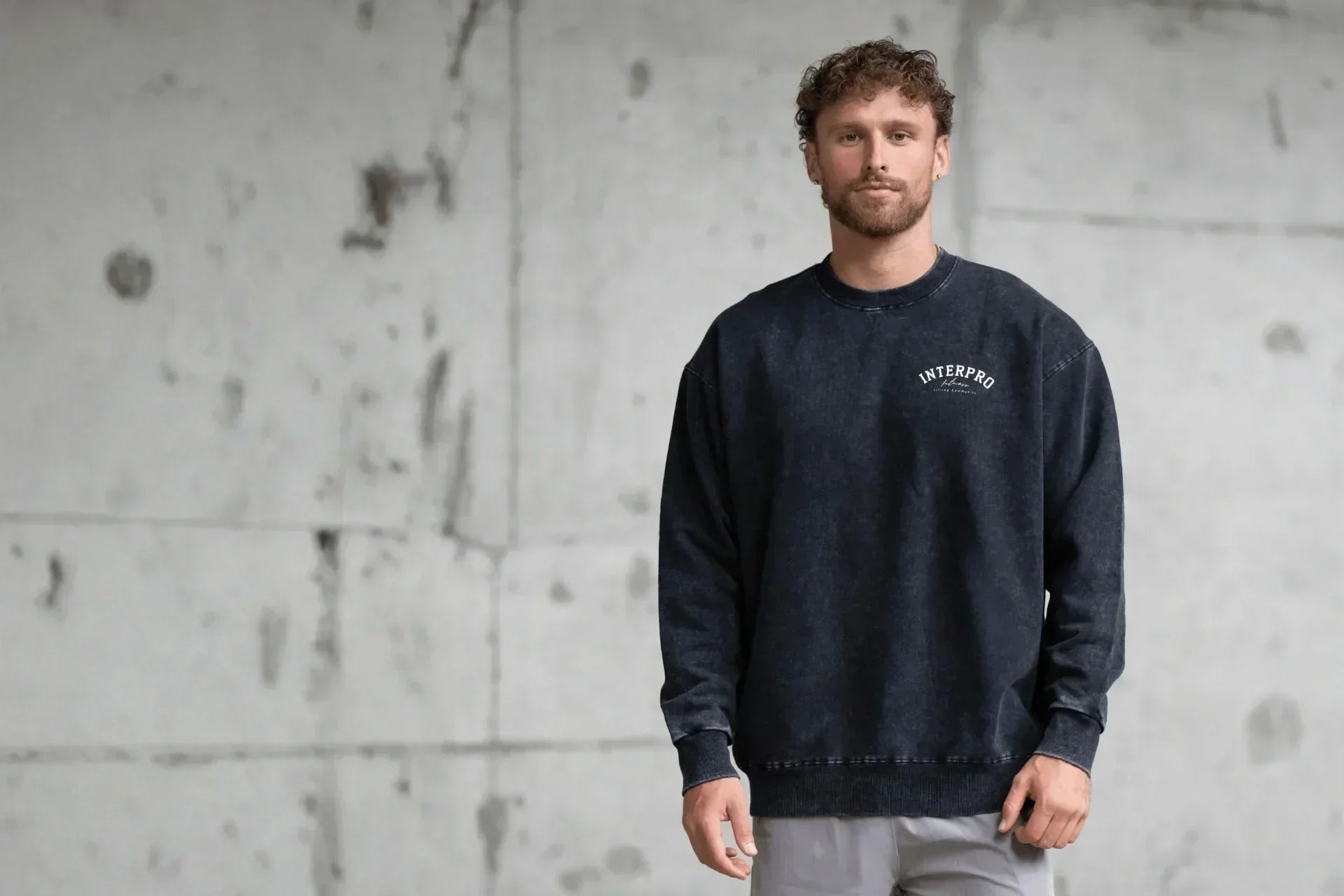 man wearing black gym sweater 