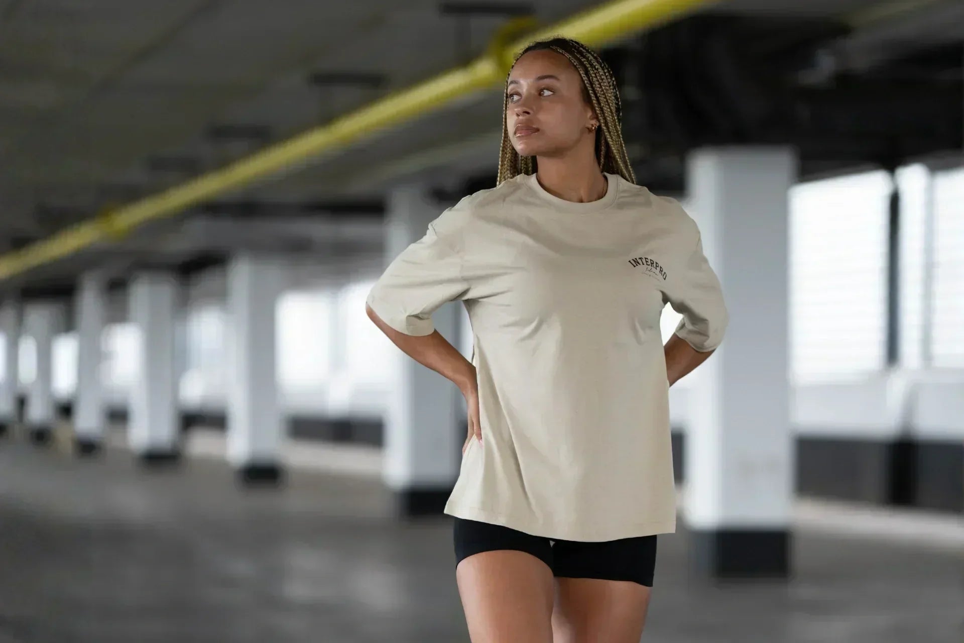 women wearing beige oversized gym t-shirt