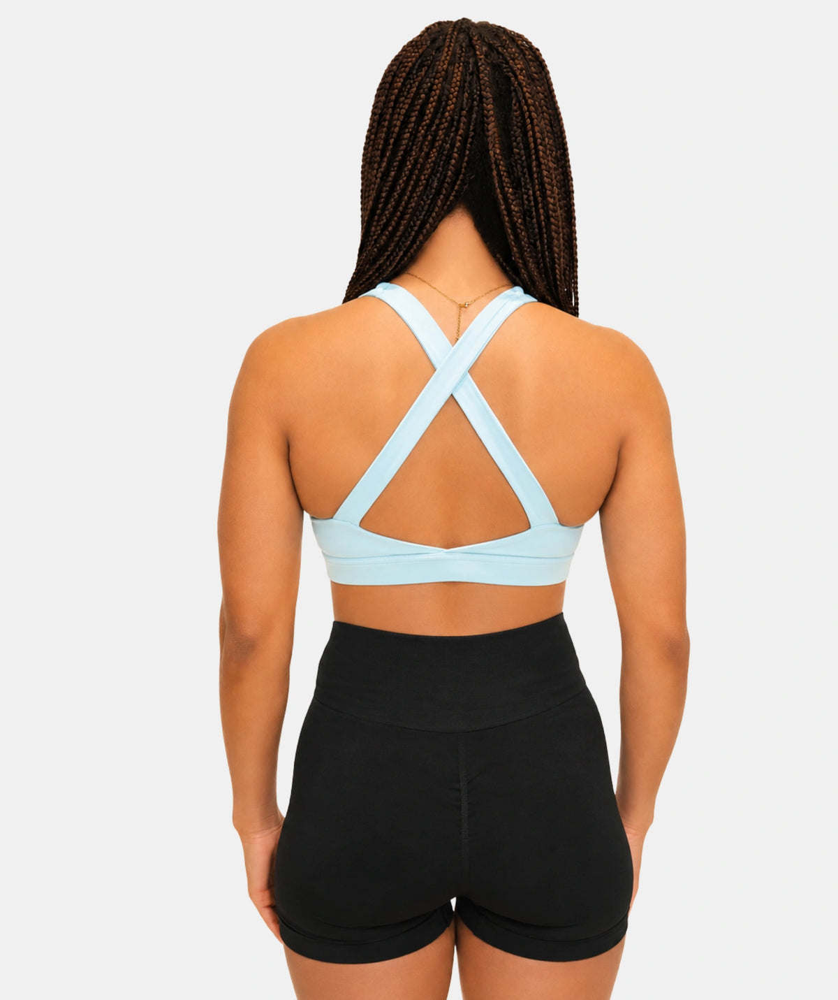 women wearing light blue cross back sports bra 