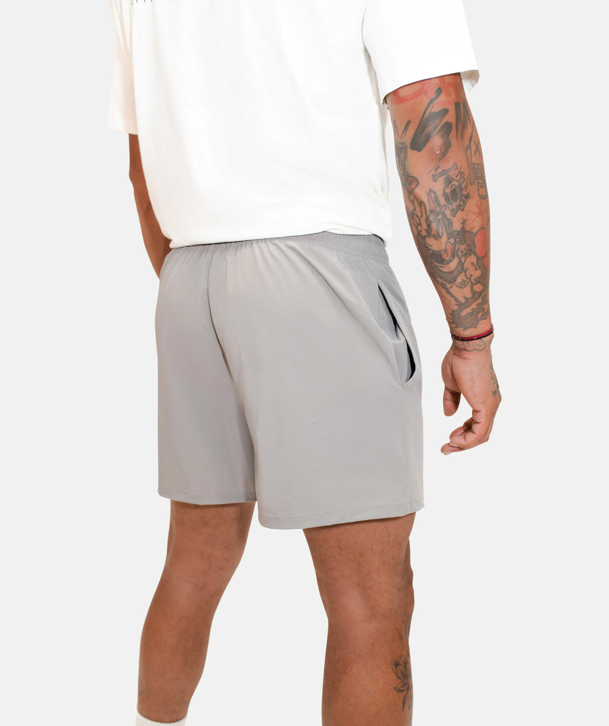 white t-shit and grey shorts