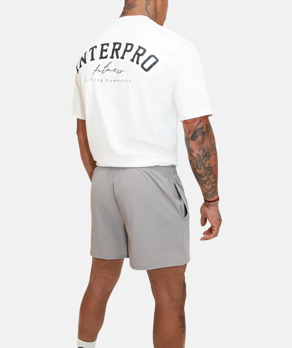 white t-shit and grey shorts