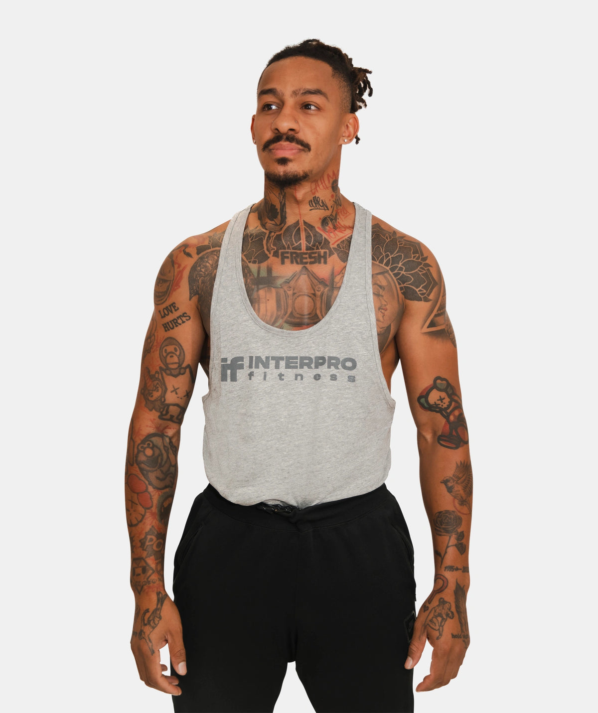 man wearing a gray tank top 