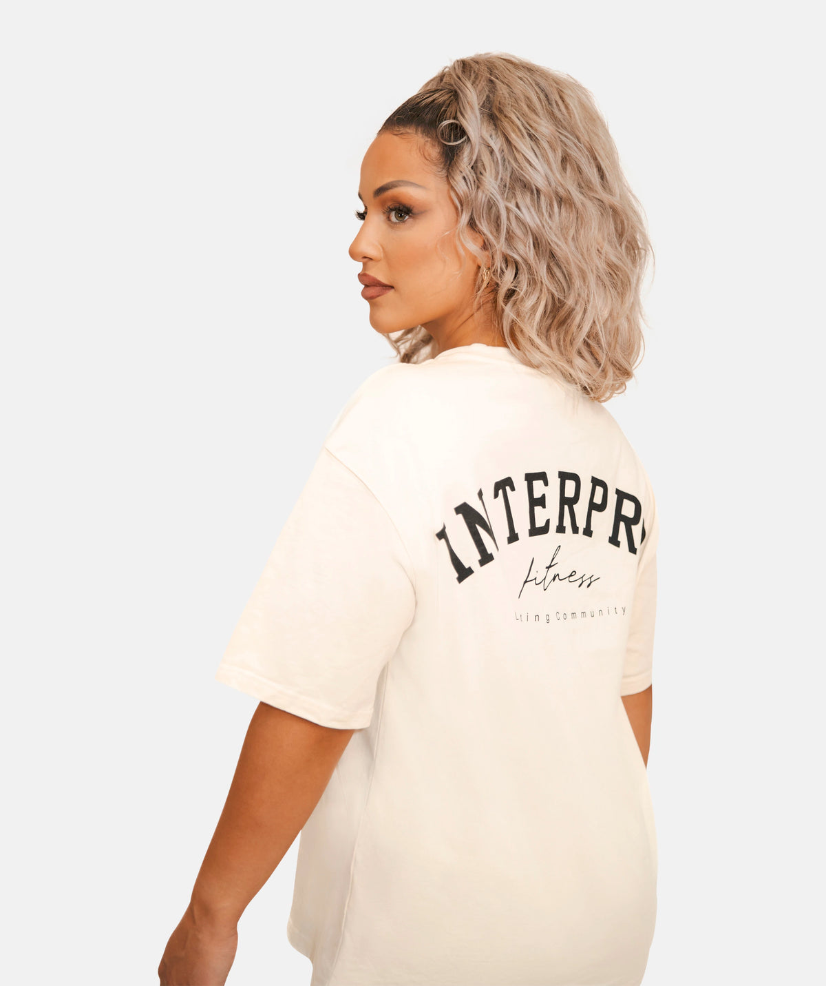 wearing a white oversized T-shirt 