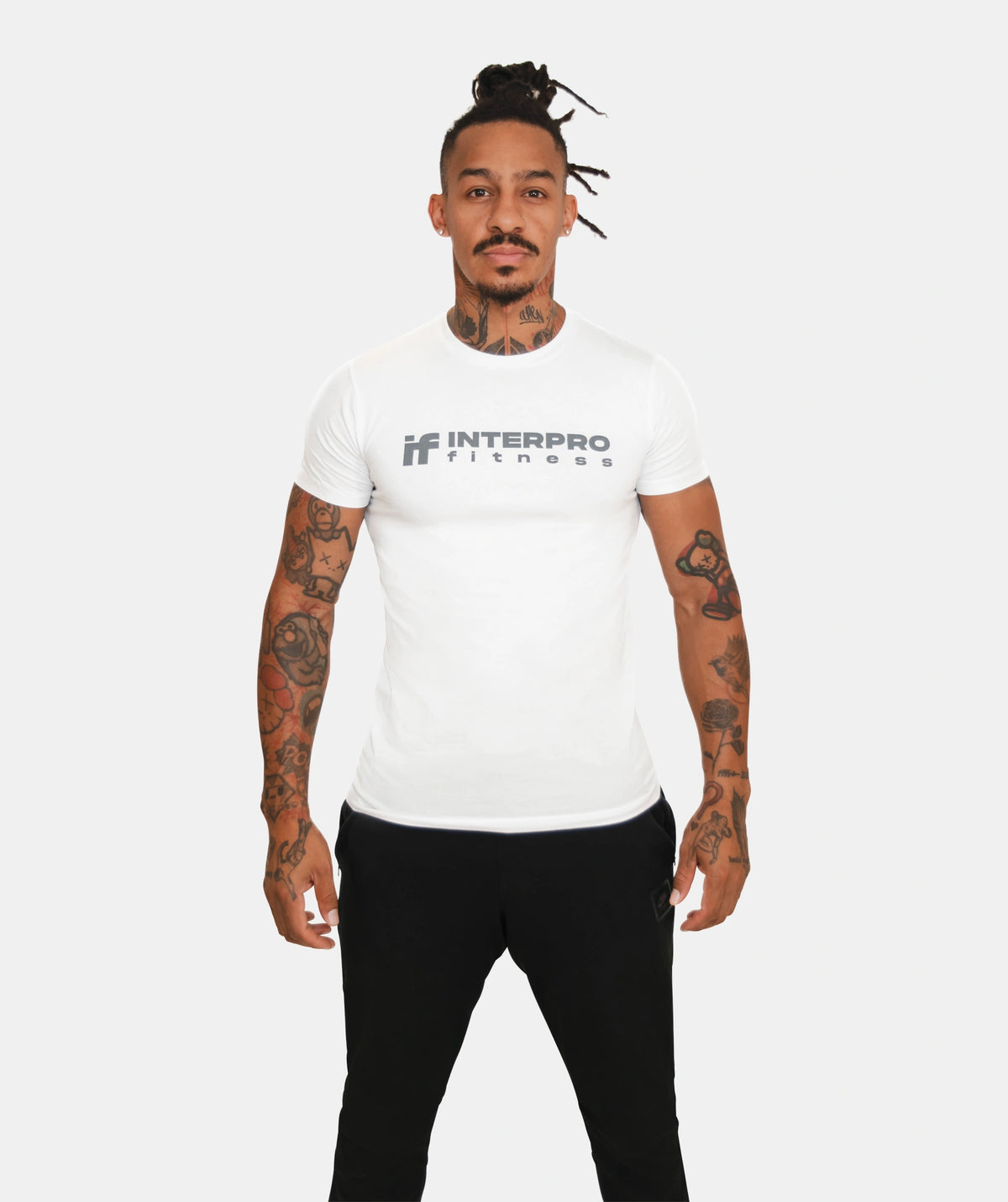 wearing a white muscle fit t-shirt 