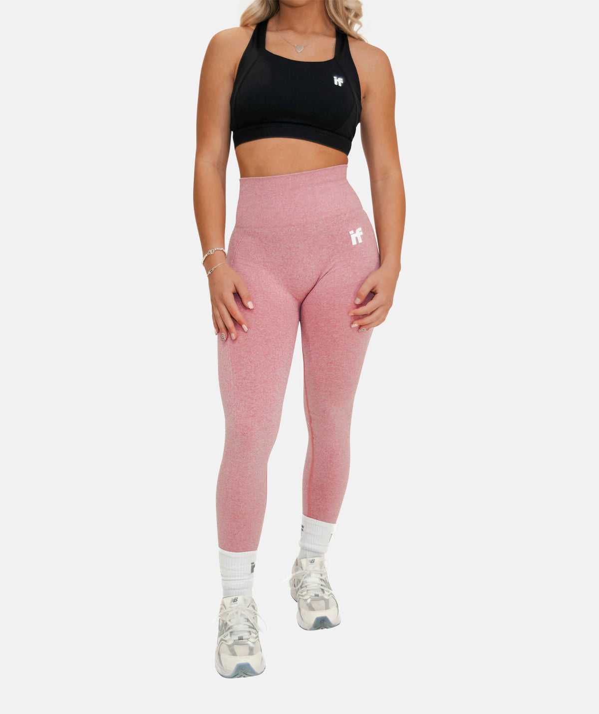  pink sculpting leggings and a black sports bra