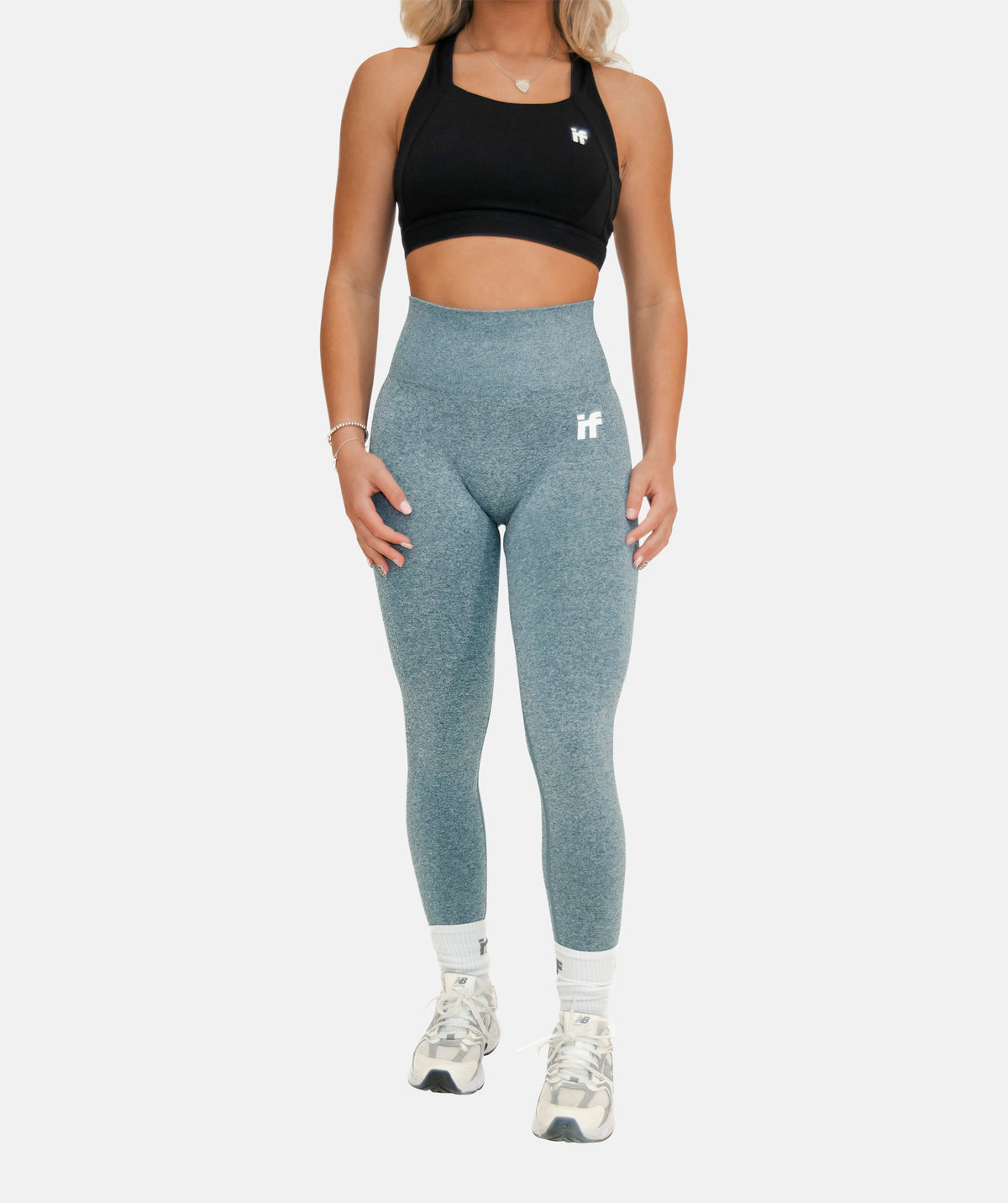 blue leggings and a black sports top