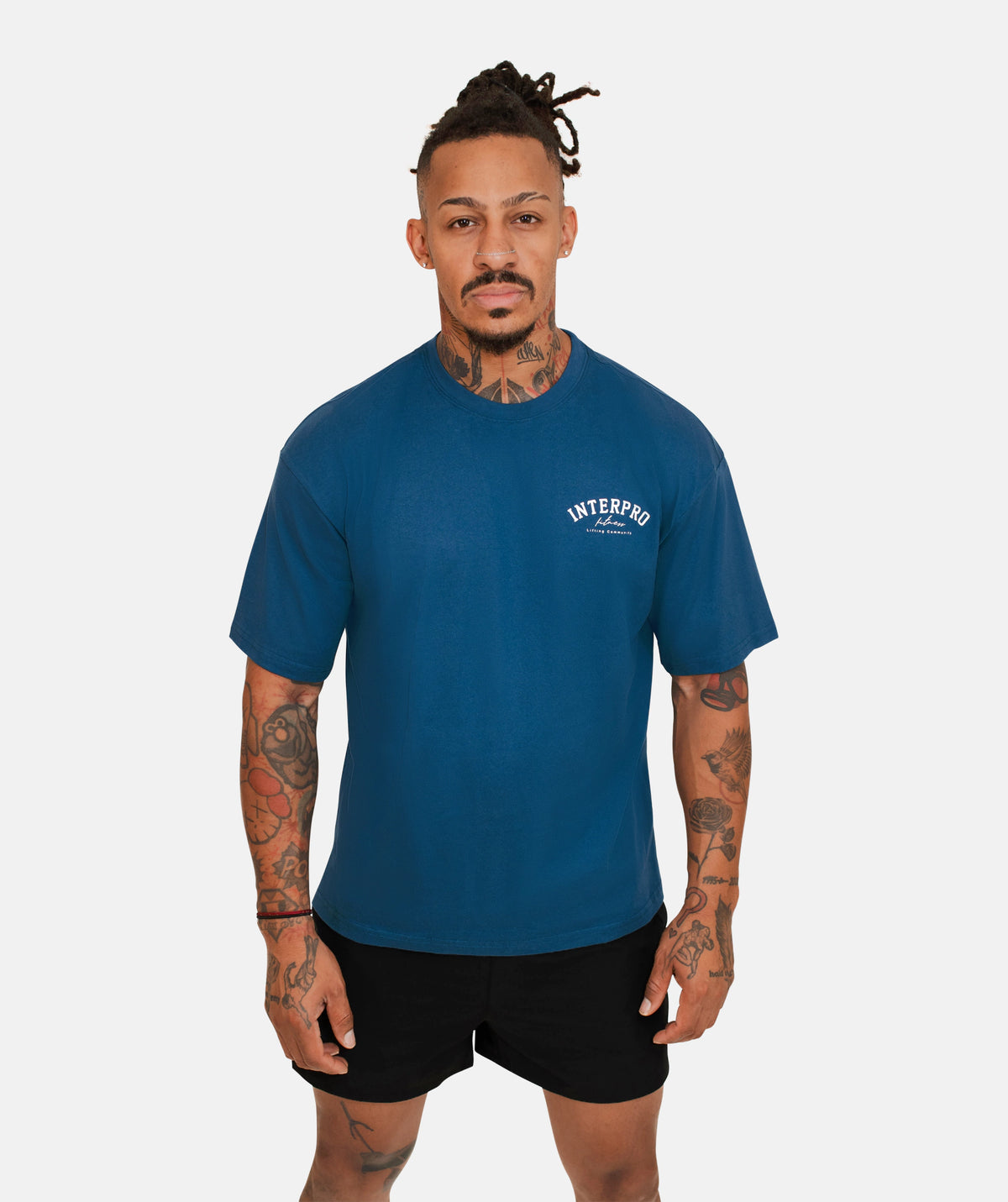 wearing a blue oversized T-shirt 