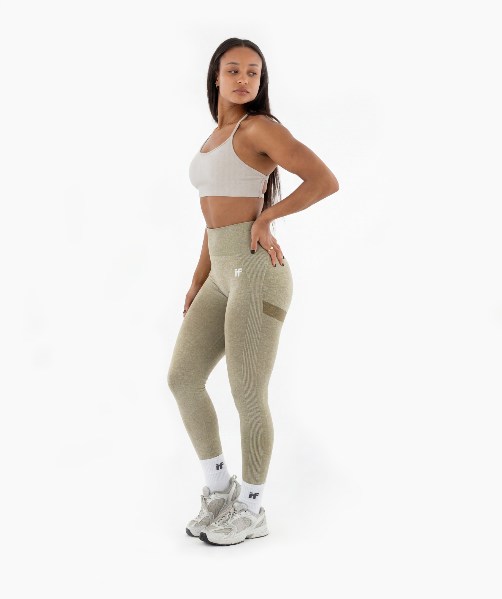 side view of Interpro Fitness womens gym leggings in marl green