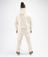 Back view: Interpro Fitness Men’s Creme Joggers, back view, full length model showing rear cuffed ankles.