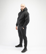 Full-body outfit image featuring Interpro Fitness Men’s Black Regular Fit Joggers styled with gym wear.
