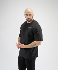 Interpro Fitness Men’s Black Oversized T-Shirt, premium athletic wear with roomy cut.