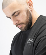 Interpro Fitness black oversized gym tee, neckline and seam detail close-up.