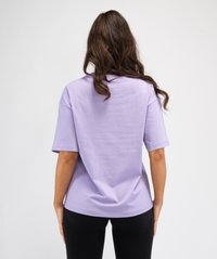 Back angle of lilac oversized workout T-shirt highlighting relaxed shape and clean silhouette