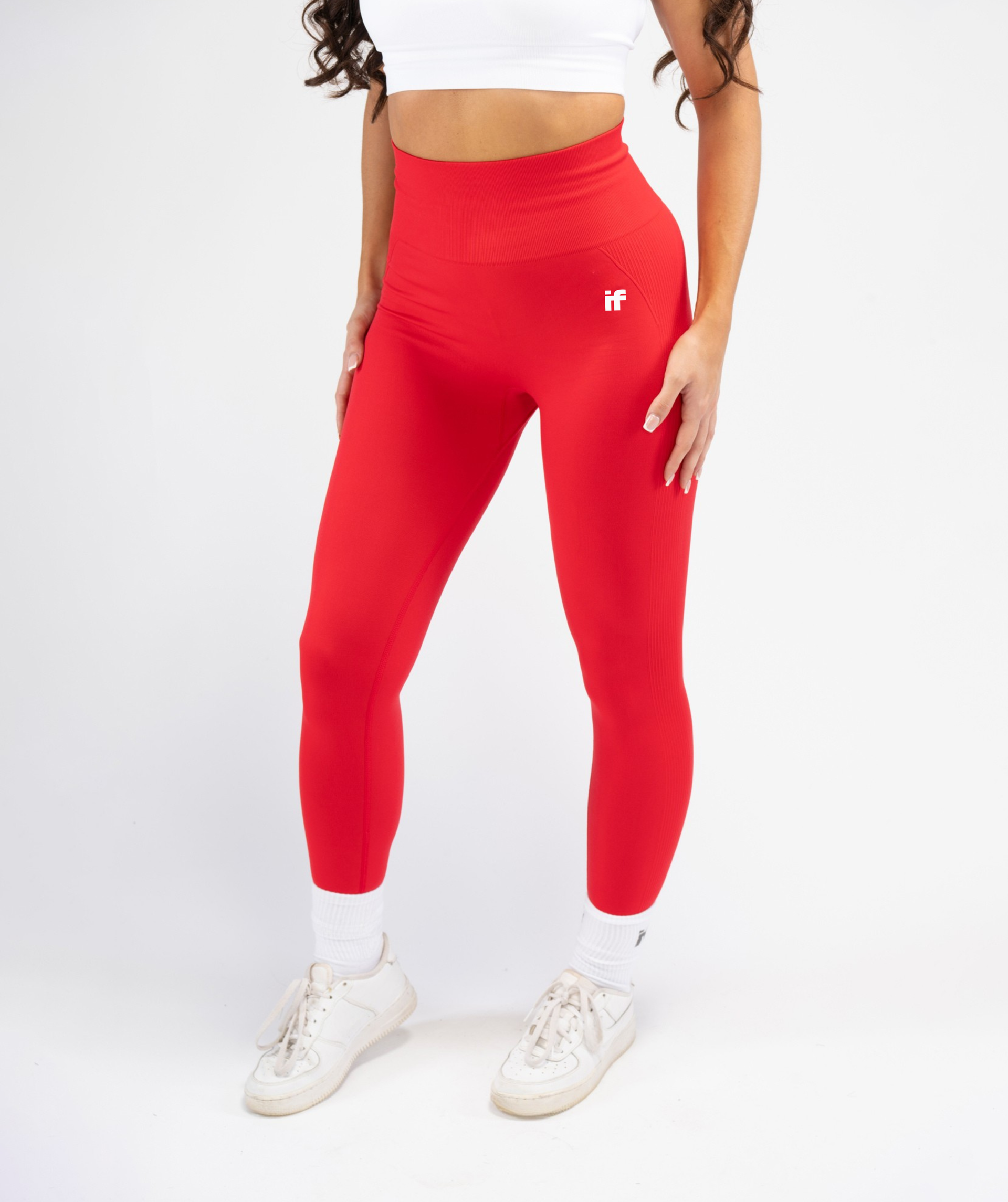 Front view of women’s Interpro Fitness red sculpting leggings showing contouring fit and high-waist design
