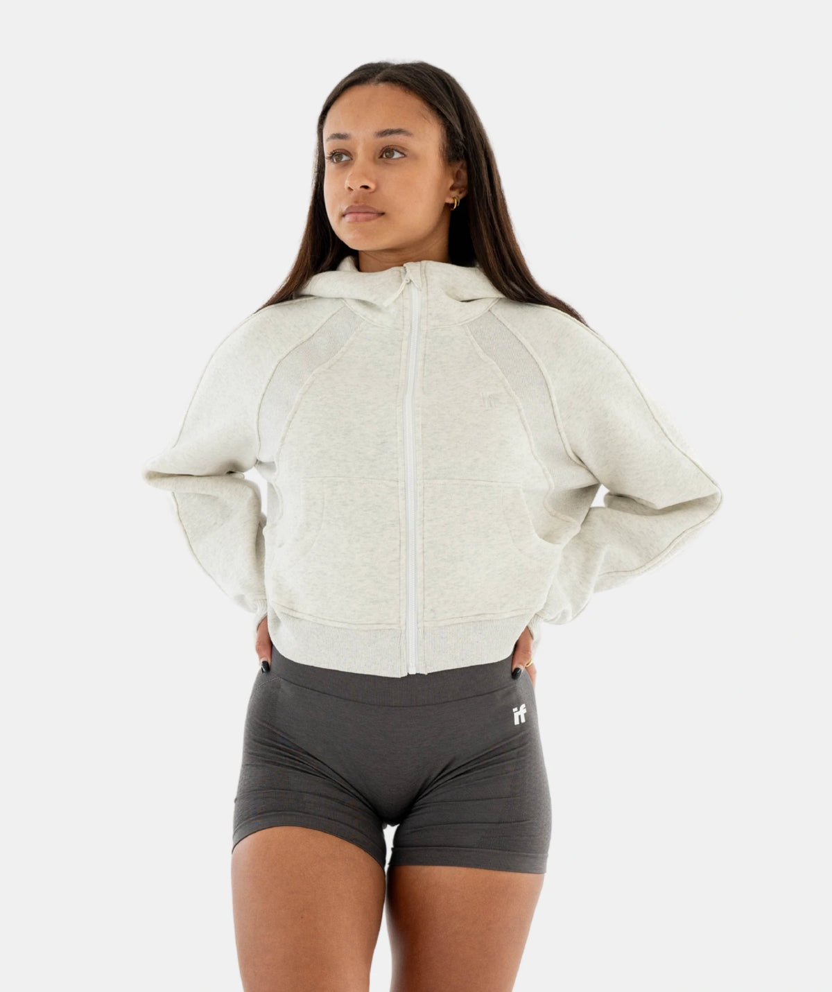beige hoodie and gray shorts