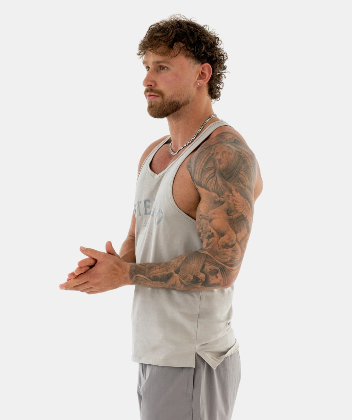 Man a light gray tank top 