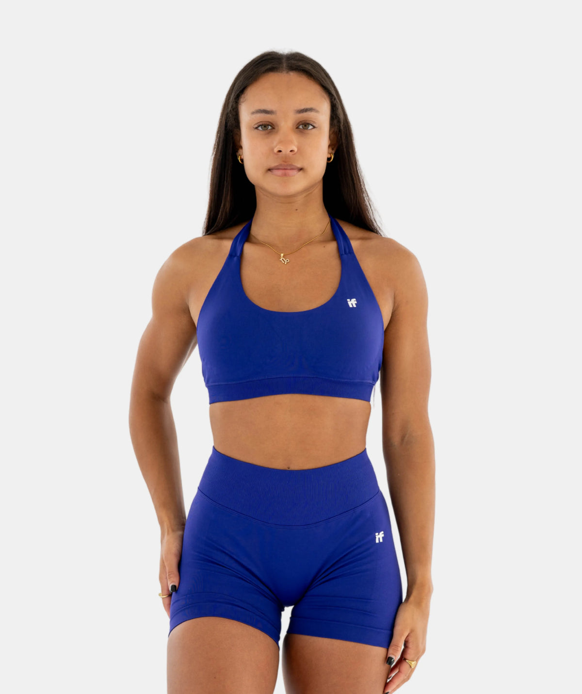 wearing blue sports bra & shorts set