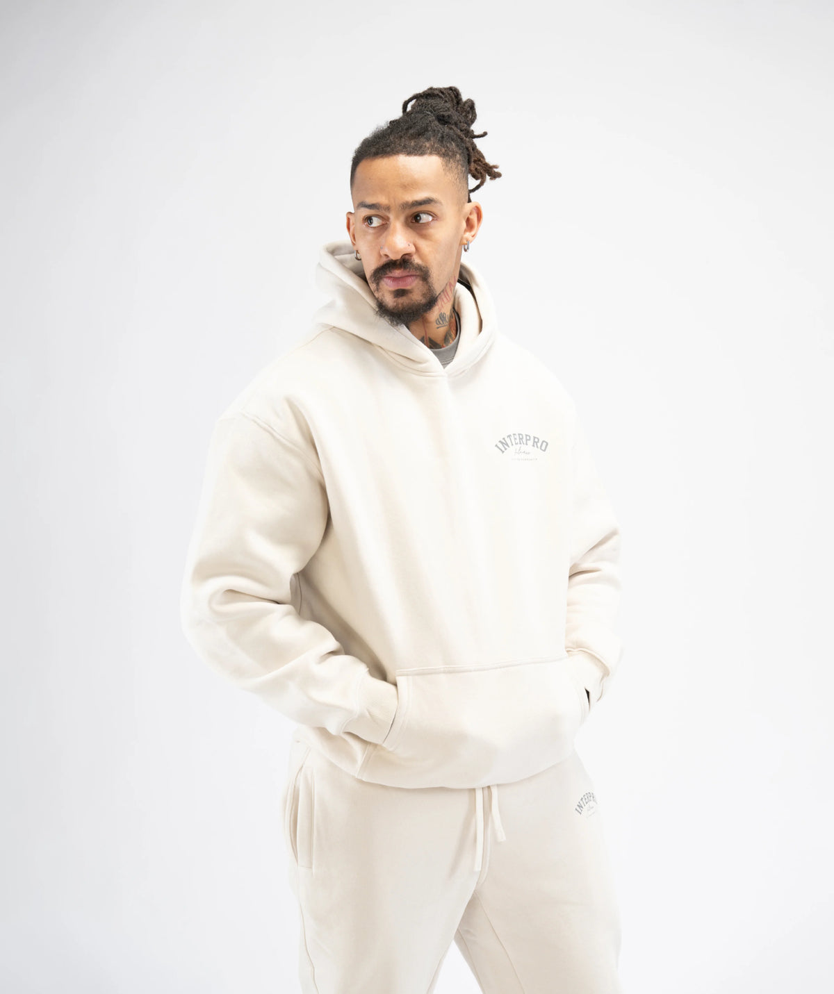 Man wearing a beige hoodie