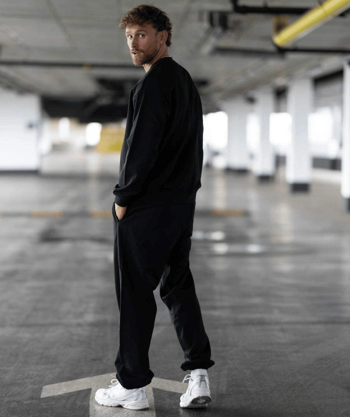 black outfit with white sneakers