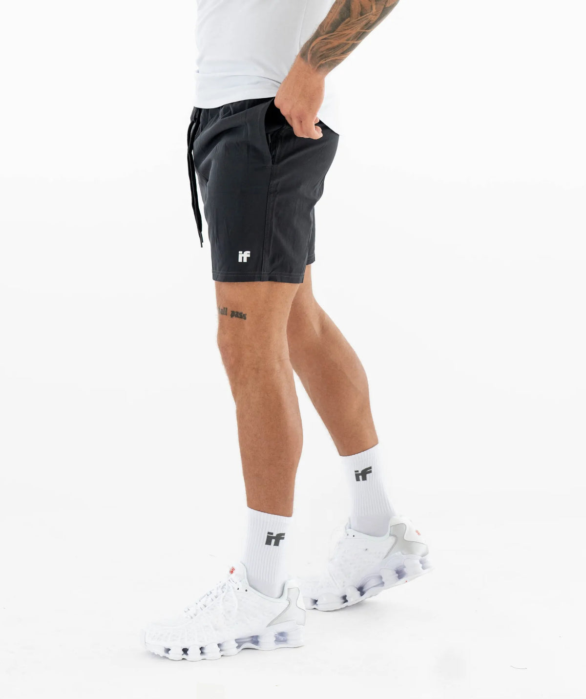 black shorts and white sneakers