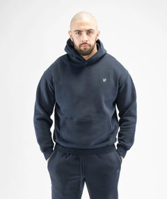 Man wearing a navy blue hoodie 