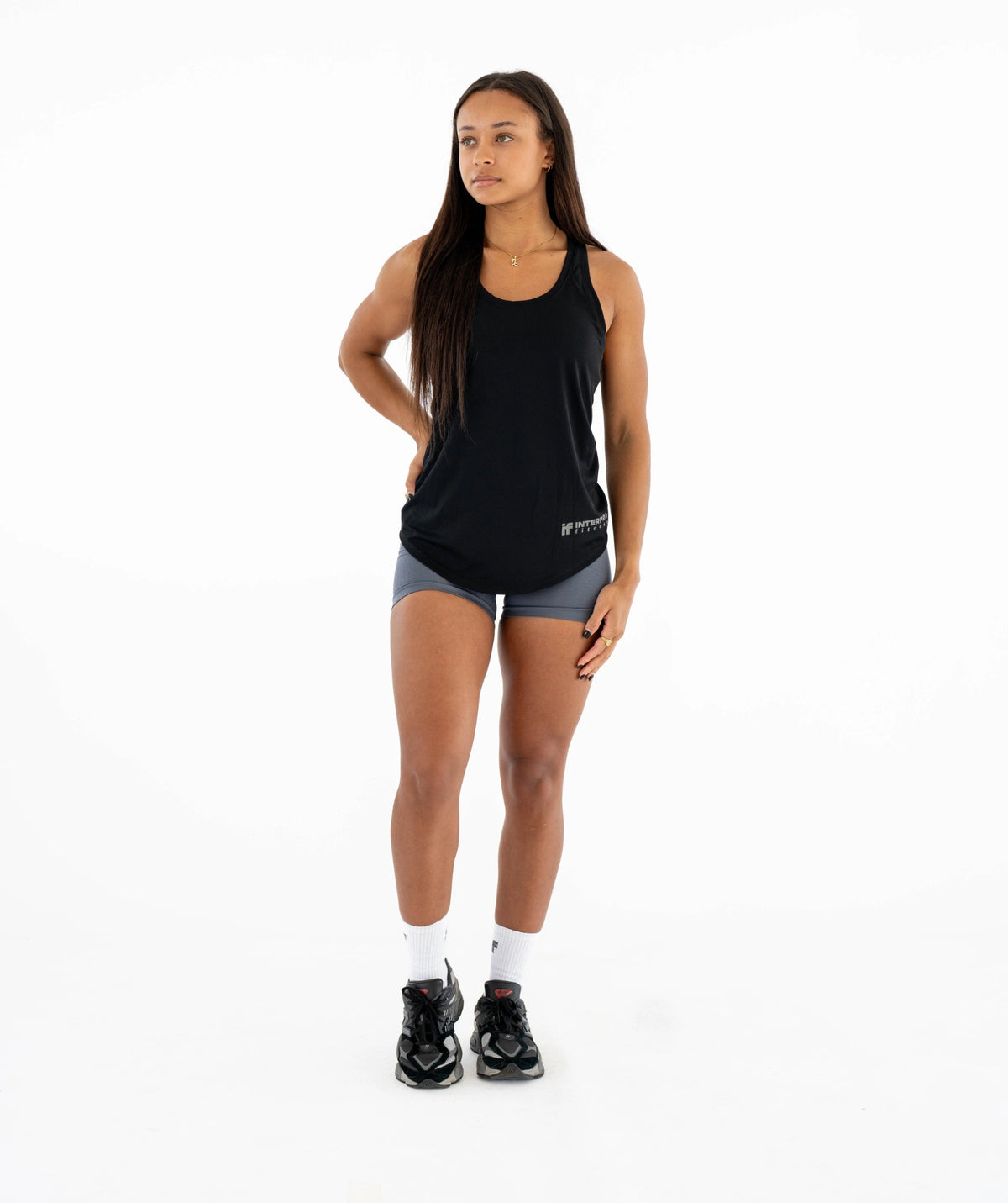 black sleeveless top and gray shorts 