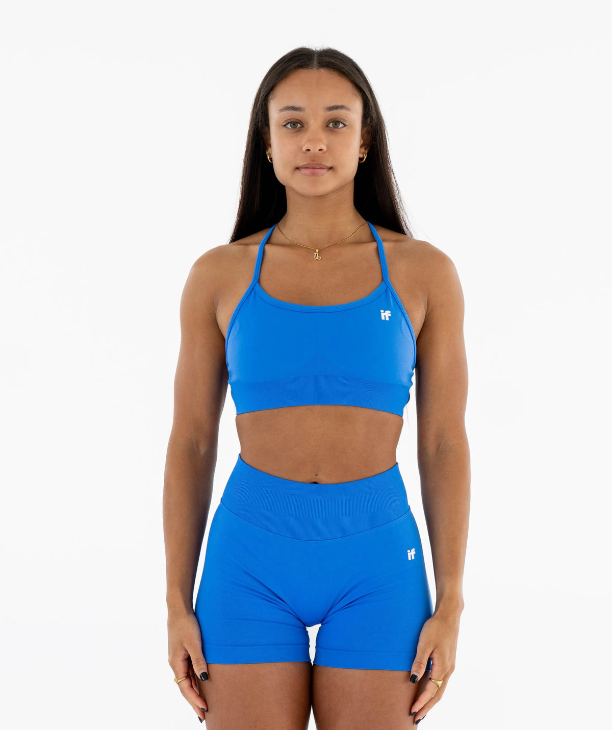 blue sports bra and shorts