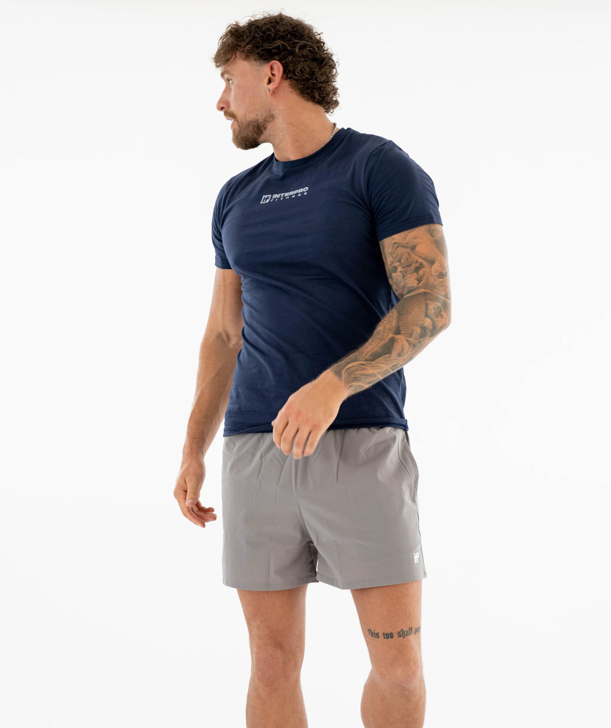 Man wearing a navy athletic shirt