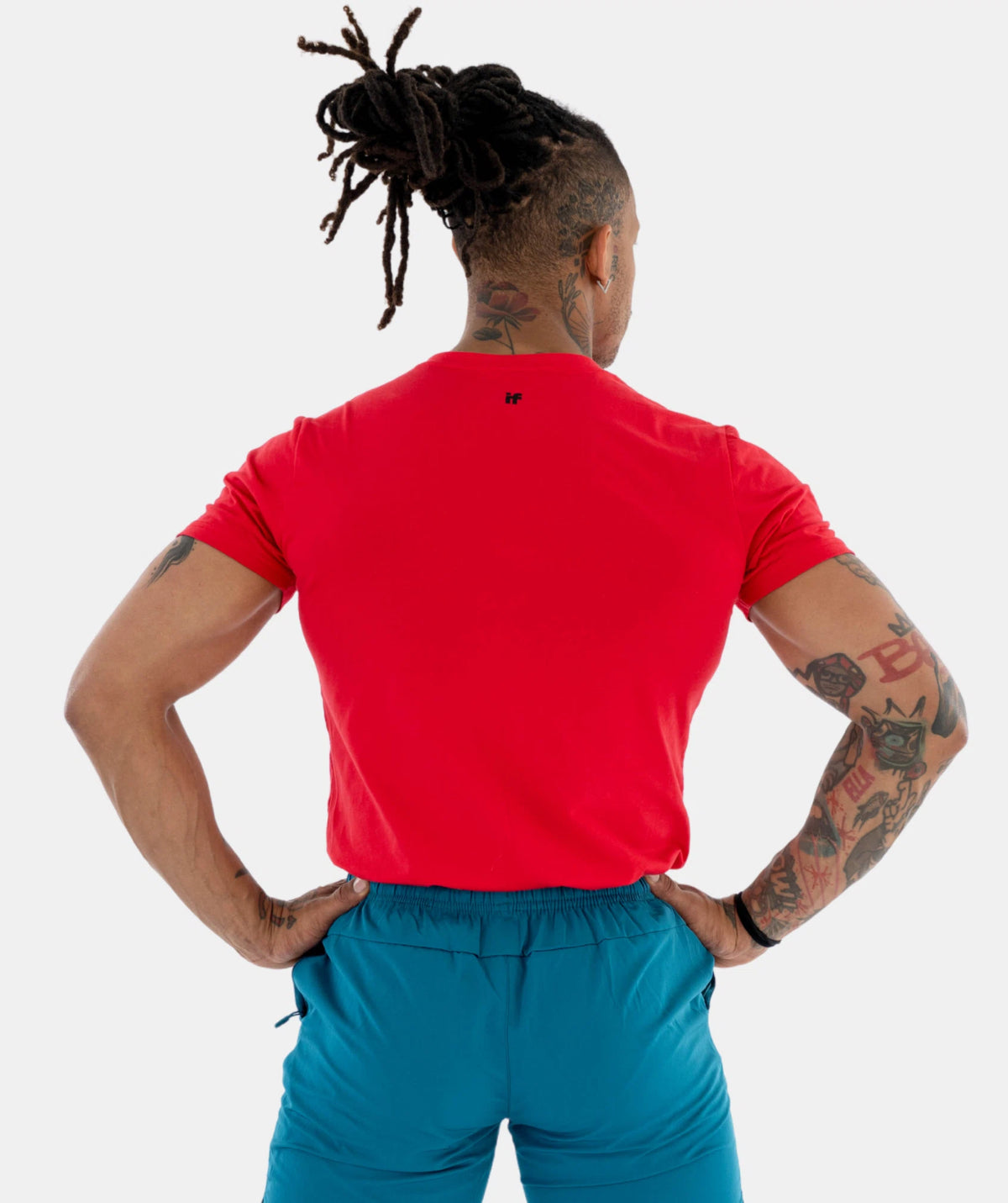 a red shirt and blue pants