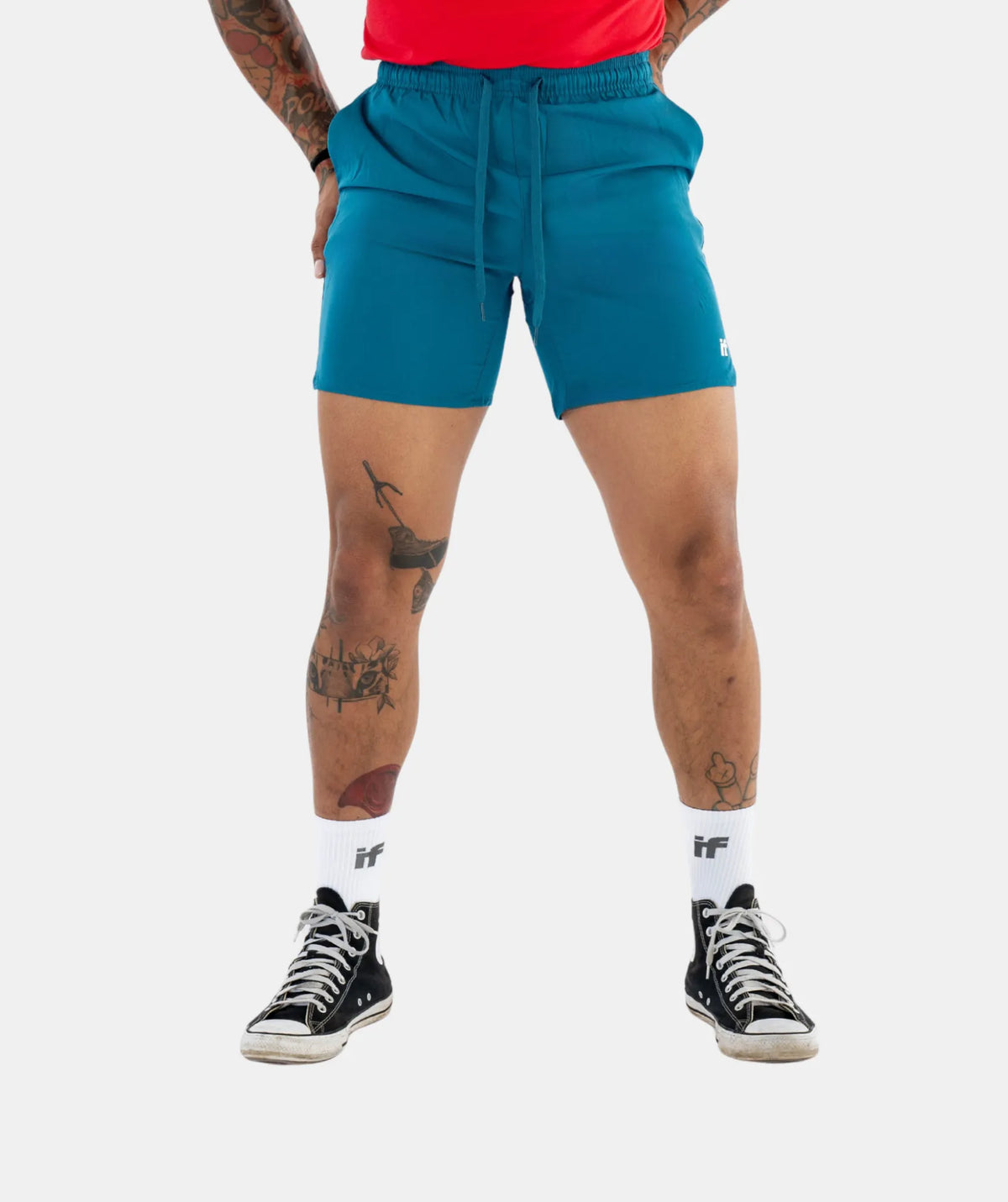 blue shorts and black sneakers