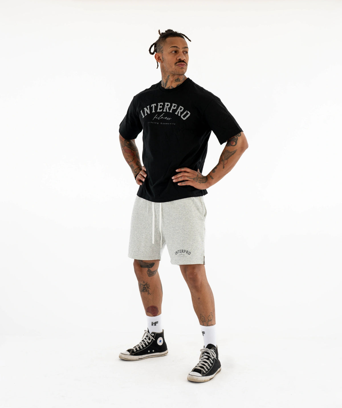 black t-shirt and gray shorts 