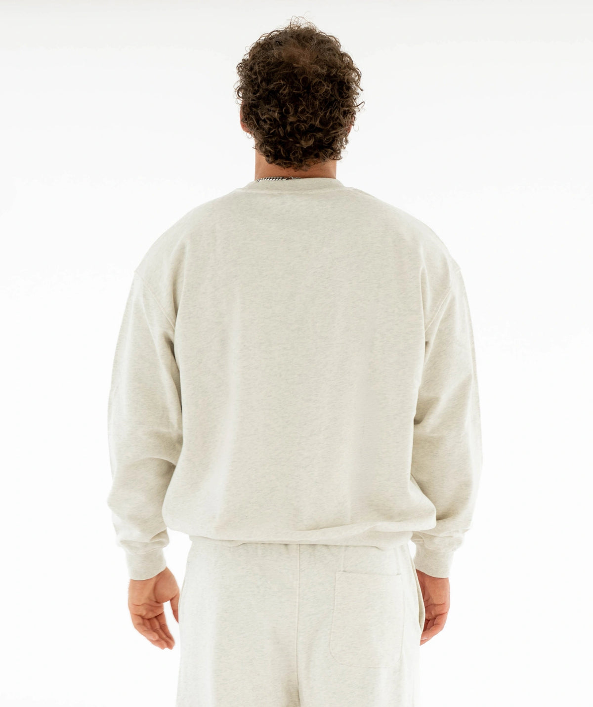  light-colored sweater and pants 