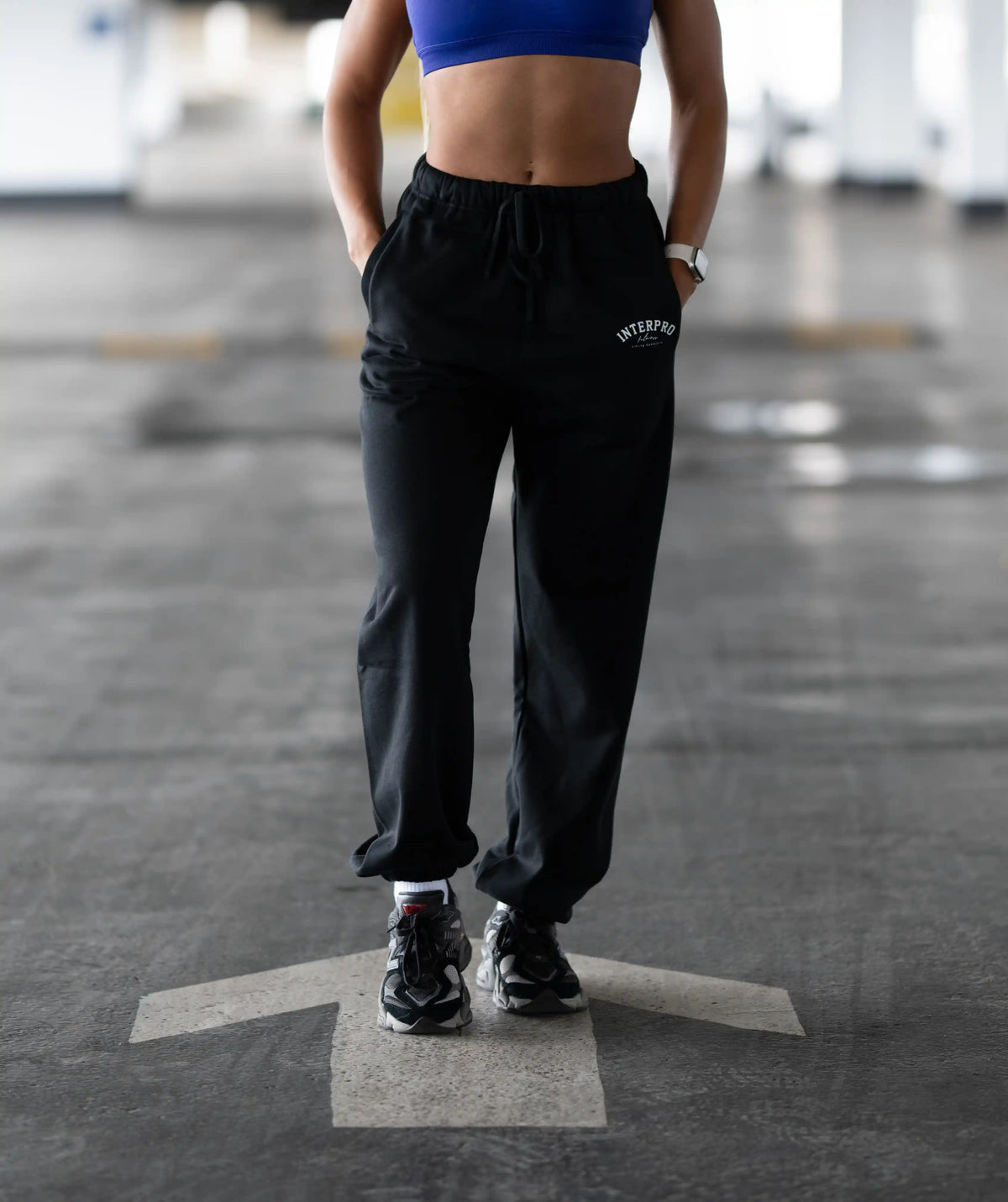 Person wearing black sweatpants