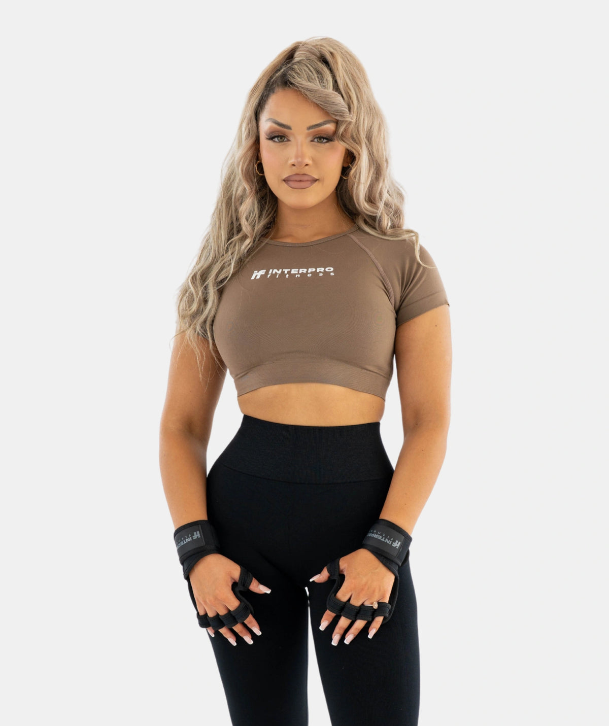 sports bra and black leggings with gloves