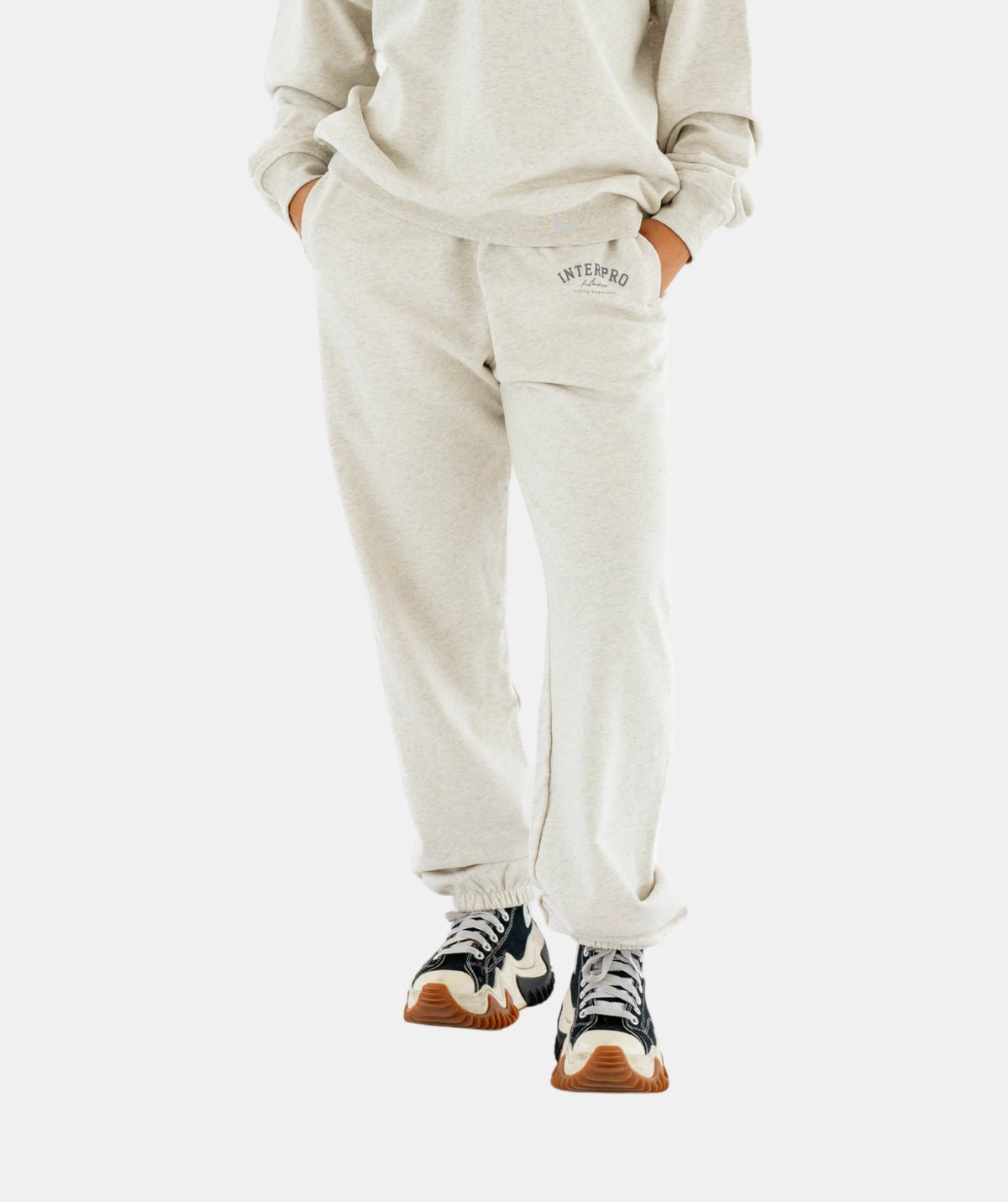 Person wearing a light gray sweatshirt 