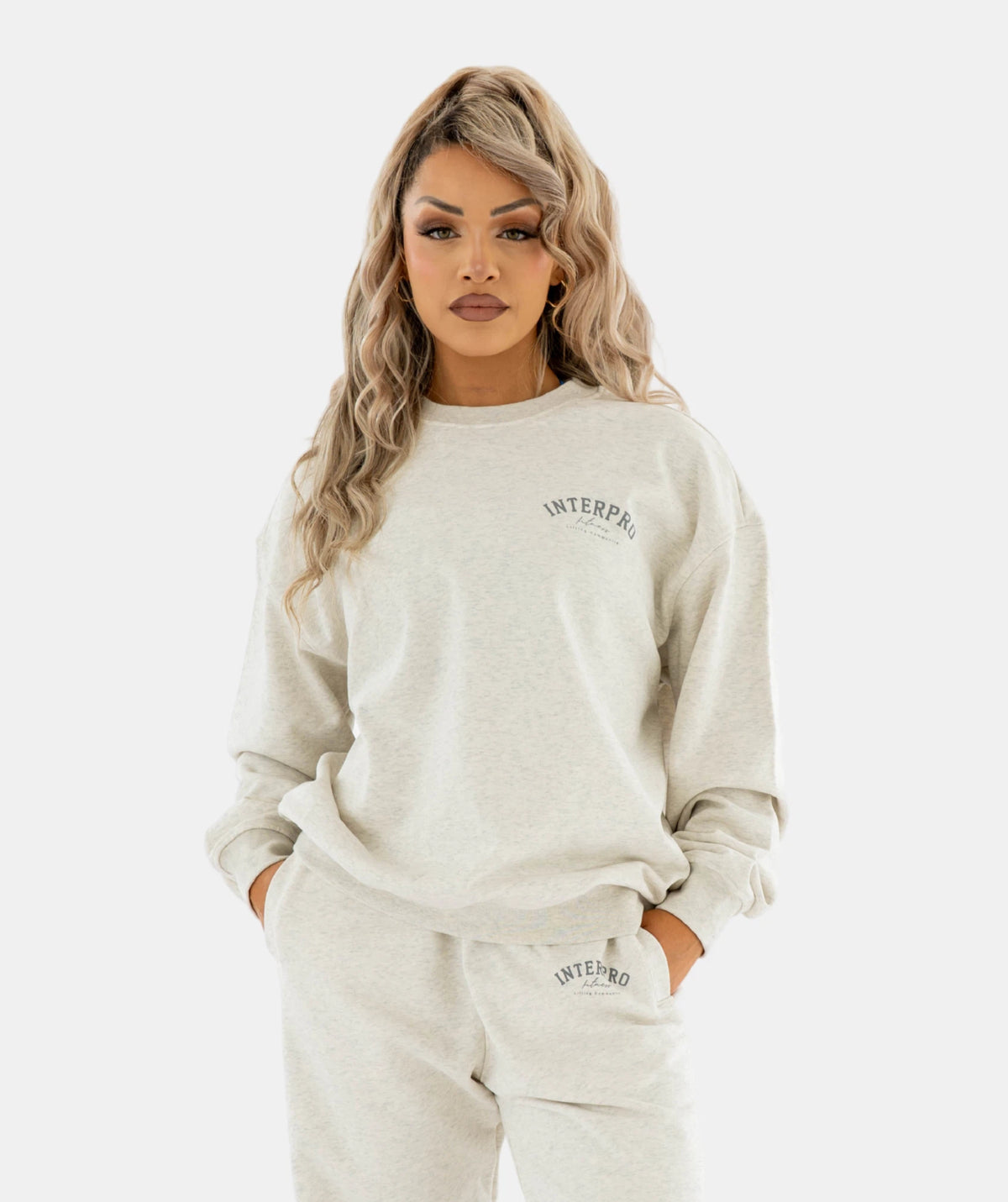 wearing INTERIOR light gray sweatshirt 