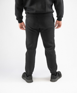 Back view of Interpro Fitness Men’s Regular Fit Gym Joggers in Black highlighting cuffed ankles and clean rear design.