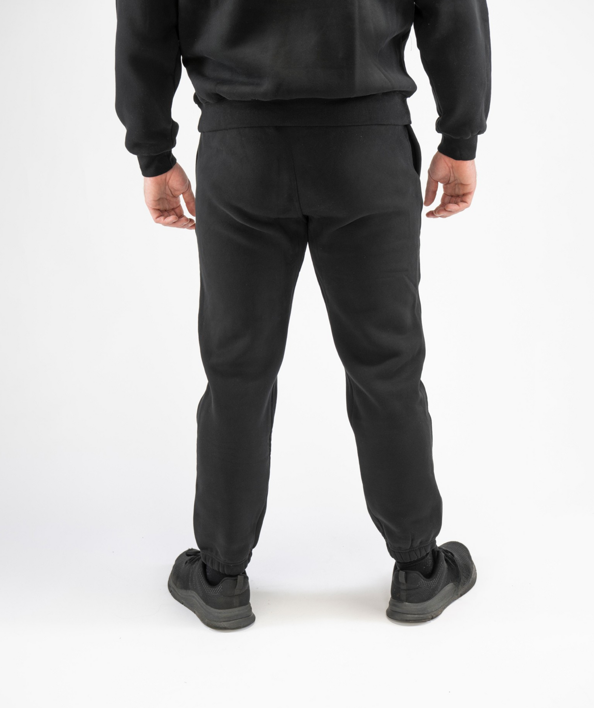 Back view of Interpro Fitness Men’s Regular Fit Gym Joggers in Black highlighting cuffed ankles and clean rear design.