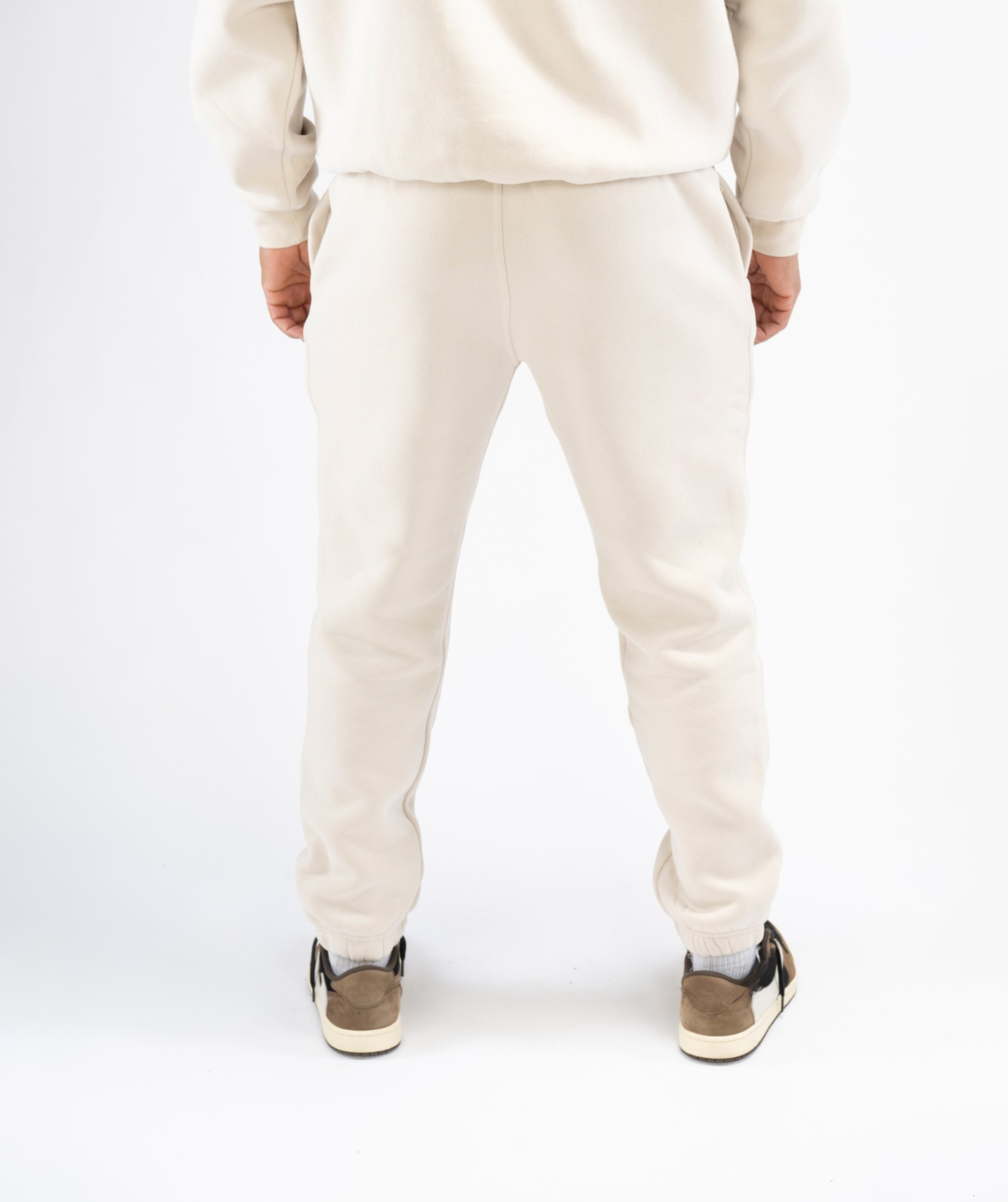 Back view: Interpro Fitness Men’s Creme Joggers, back view showing cuffed ankles.