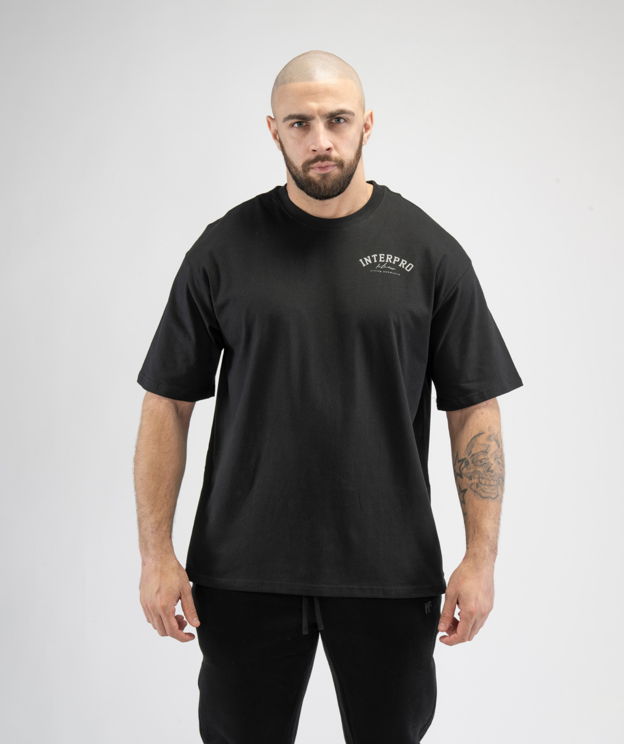 Interpro Fitness Men’s Black Oversized Gym T-Shirt with relaxed athletic fit, front view.