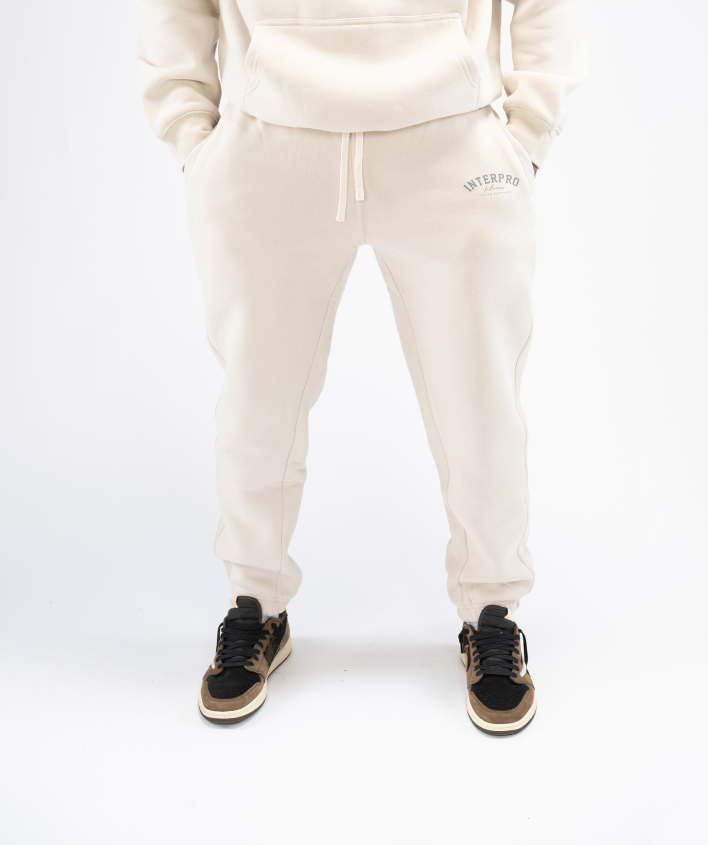 Front view: Interpro Fitness Men’s Creme Joggers, front view showing tapered fit and drawstring.