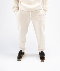 Front view: Interpro Fitness Men’s Creme Joggers, front view showing tapered fit and drawstring.