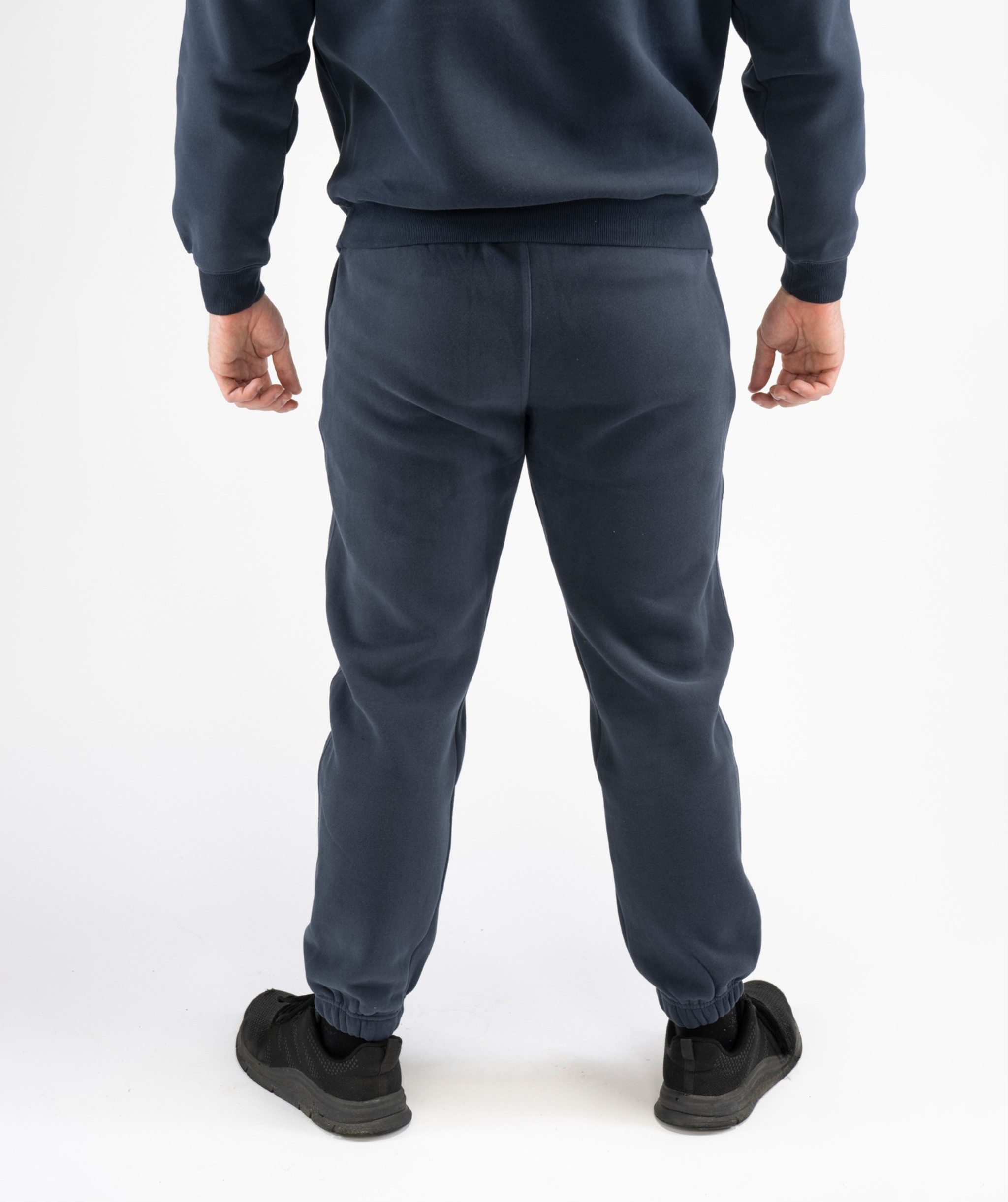 Back view of Interpro Fitness Navy Blue Men’s Regular Fit Joggers with cuffed ankles and clean panel design.