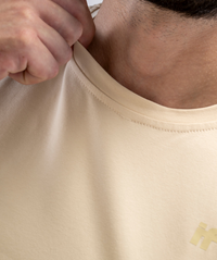 Close-up of neck and stitching on Interpro Fitness Men’s Beige Gym Tee.