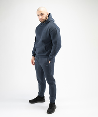 Full-body outfit image featuring Interpro Fitness Men’s Navy Blue Regular Fit Joggers styled with gymwear.