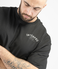 Close-up view of men’s oversized black gym T-shirt from Interpro Fitness