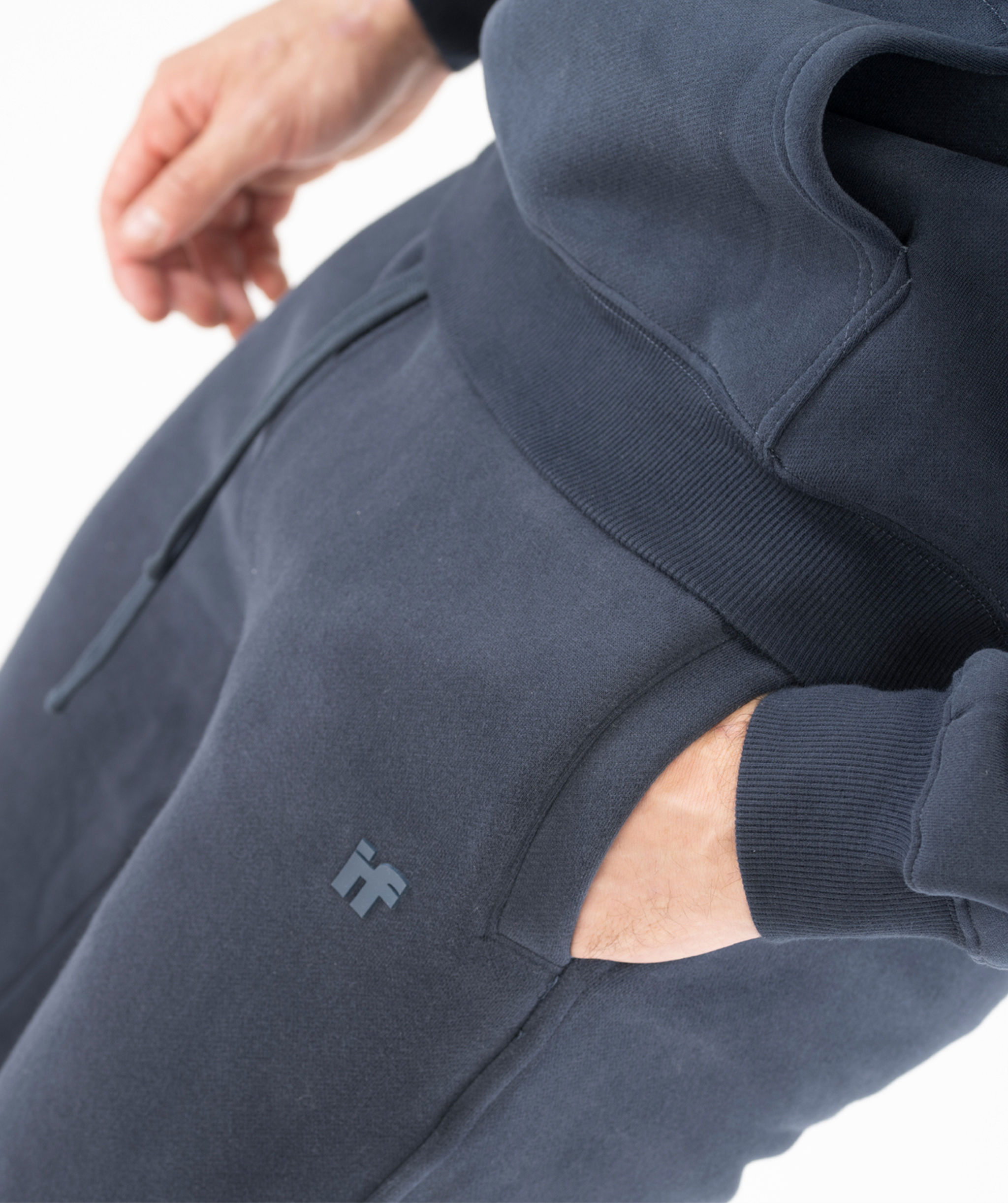 Detail shot of side pocket stitching on Interpro Fitness Men’s Regular Fit Joggers in Navy Blue.