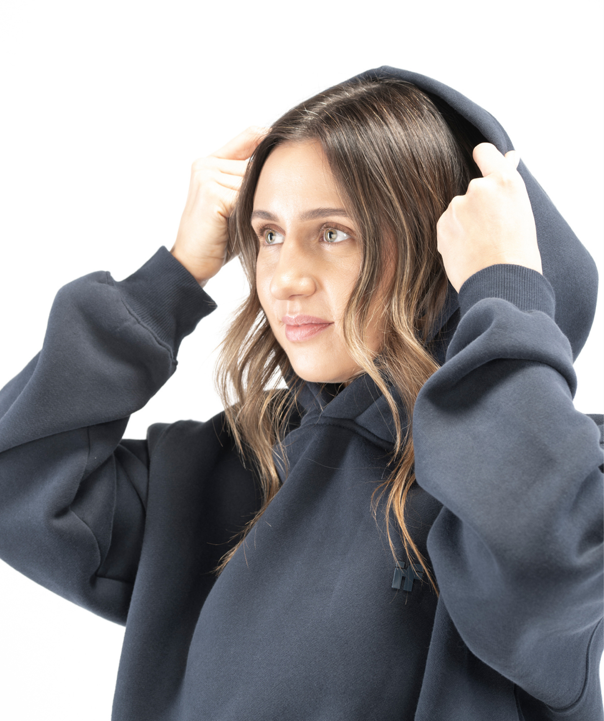 Detail shot of navy blue hoodie fabric showing soft cotton-blend texture and smooth finish